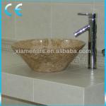 Beige marble bathroom sink round in shape