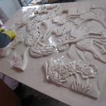 Natural hand carved stone relief